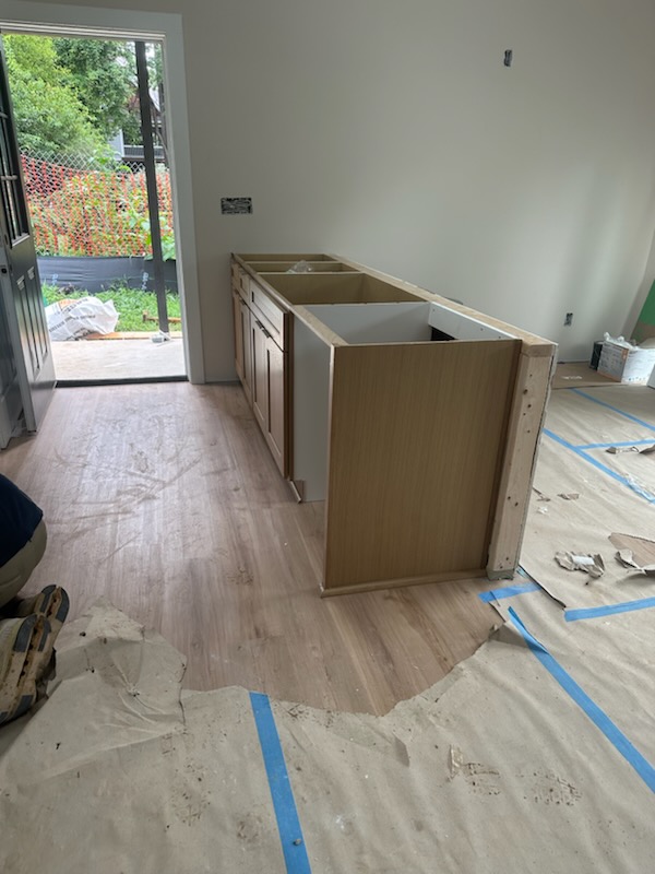 Kitchen island cabinet boxes and panel framing during a Suwanee, GA cabinet installation